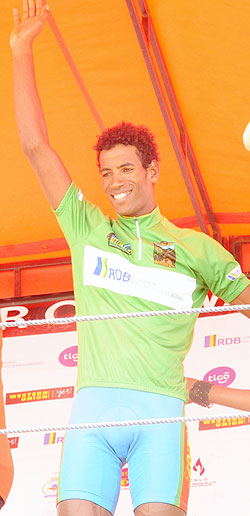 Eritreau2019s Daniel Teklehaimanot waves to the crowd after being crowned champion of this yearu2019s tour of Rwanda. (Photo. J. Mbanda)