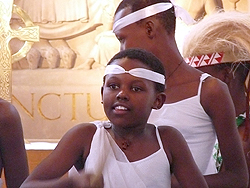 Clementine Byukusenge (9 years) drumming at Doun House School, Wokingam.