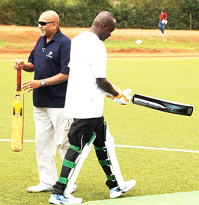 ICC's Cassim Suliman (left) and Sports minister Joseph Habineza (right) prepare for the ceremonial opening of the T20 game on Saturday. (Photo; T. Kisambira)