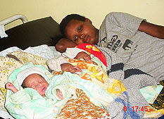 Elimine Musabyimana and her babies.(Photo by S. Rwembeho).