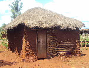The type of houses to be replaced by permanent iron sheet- roofed ones across the country. (Photo by. S. Rwembeho).