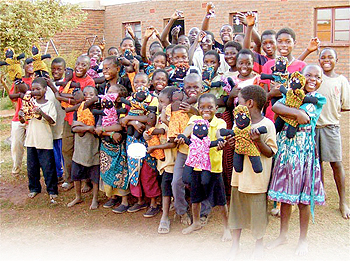 Group of kids with dolls.