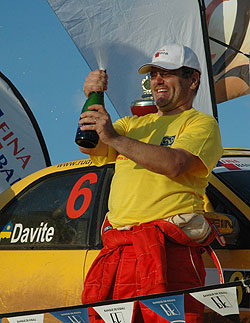 Davite Giancarlo pops the champaigne after being crowned 2007 National Rally Champion. The ace driver finished second in last year's ARC. (File Photo)