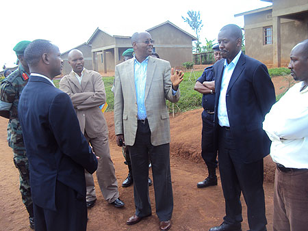 Minister James Musoni (c) talking to the Mayors. Photo by S. Rwembeho.