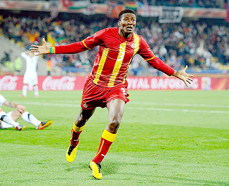 For Africa! Asamoah Gyan celebrates scoring Ghana's extra-time winning goal to the delight of a continent.