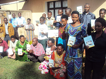 Poultry farmers pose for a photo after the training. (Photo by S. Rwembeho).