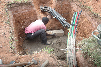 A man lays Fibre Optic cables (File Photo)