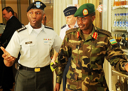 US AFRICOM Boss Gen. William Ward (L) with RDF Chief of Land Forces Lt.Gen Ceasar Kayizari on the formeru2019s arrival at Kigali International Airport (Photo T Kisambira)