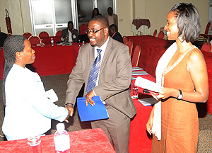 Minister of Trade and Industry Monique Nsanzabaganwa (L) greets Dr.Andrew Seguya as RDB's Rica Rwigamba looks on. (Photo J Mbanda)
