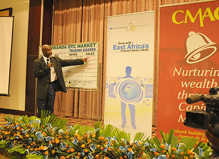 Celestin Rwabukumba, the Operations Manager of CMAC conducts tarding during the launch of Nation Media's cross listing on the ROTC market. Rwanda will laun a fully fledged stock exchange on January 31. (file photo)