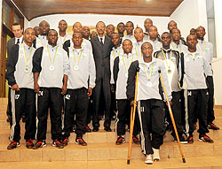 The Junior wasps pose for a photo with President Kagame he met them at Village Urugwiro, yesterday. (Photo / T. Kisambira)