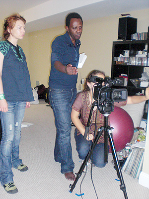 Rwandau2019s Gilbert Ndahayo (C) behind cameras on film set in New York, directing his film u2018Why me, why Sara.u2019
