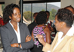 Victoria Akyeampong UNFPA representative (R), stresses a point to Diane Karusisi the Acting DG of NISR