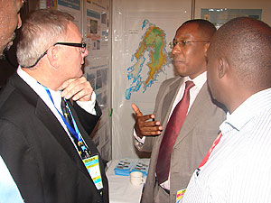 Yussuf Uwamahoro the energy sector coordinator in MININFRA speaks to one of the investors during the Petroleum Conference yesterday. (G Muramira)