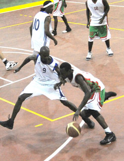 Rwanda's point guard Aboubacar Barame tries to defend against Burundi yesterday. Although he didnot get on the score sheet, he still had a good game. (Photo / J. Mbanda)