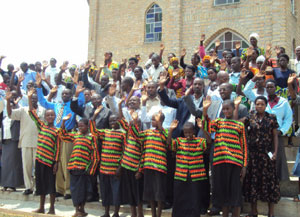 Compassion International officials pose with the graduated beneficiaries. Photo D.Sabiiti
