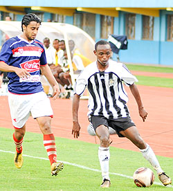 APR's Jean Claude Iranzi tries to dribble past a Club Africain player during the first leg. The teams meet again this afternoon in the second leg. (File photo)