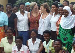 Linda Trau (L) shares a light moment with daughter Jenny during a group photo with some of the women (Courtesy photo)