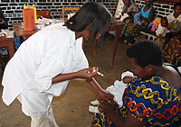 A nurse immunises a baby at one of Rwanda's rural Health Centres. (File Photo)