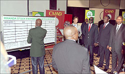 Celestin Rwabukumba condusts trading on stock exchange during the listing of Bralirwa. (File photo)