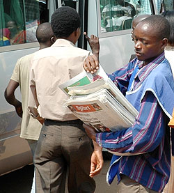A Newspaper vendor in Kigali City. MHC has released a new list of accredited media houses (File Photo)