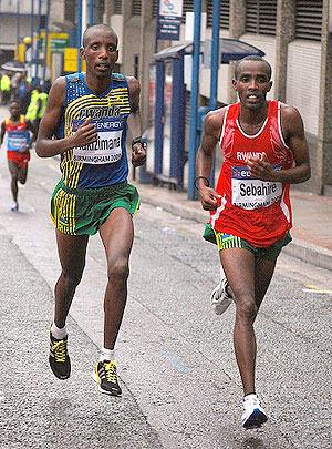 Gervais Hakizimana (L) and Eric Sebahire (L) taking part in a road race in France last year. The two are on the team for the World Cross Country Championship in Spain. (File photo)