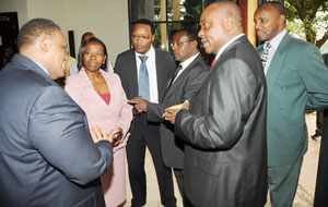 Trade and Industry Minister Monique Nsanzabaganwa (2L) talks to stakeholders in the Hotel Industry at a meeting on Friday. (Photo J Mbanda)