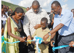 A young Boy joins Prime Minister Bernard Makuza and other officials at the Launch of Kiliba Dam in Gatsibo District on Wednesday. (Photo J Mbanda)
