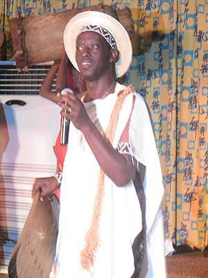 Dr Gaspard Ntahonkiriye performs to the audience.