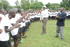 Youth Minister Protais Mitali (with hat) joins the Iwawa trainees in a dance recently. (File Photo))