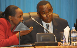 Premier Bernard Makuza (R) consults Agriculture Minister Dr Agnes Kalibata, in Parliament, yesterday (Photo T Kisambira)