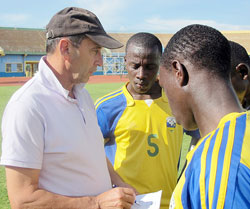 Richard Tardy explaining some thing to his players after an intensive workout at Amahoro Stadium. (File photo)