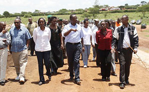 Prime Minister Bernerd Makuza and other officials inspecting a dam under construction officials inspecting (Courtsey photo)