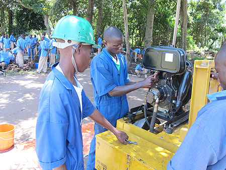 Iwawa youth work on a brick making machine. The skills training center is well equipped. (Photo: D. Umutesi)