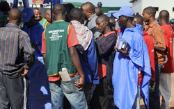 Customers lining up for TIGO SIM cards (Photo T. Kisambira)