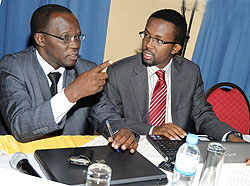 EAJA Secretary General Omar Farouk (R) and Rwanda Journalists Association's Gaspard Safari during a meeting in Kigali last year. (File Photo)