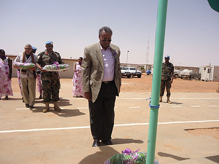 UNAMIDu2019s Deputy Joint Special Representative, Mohamed Yonis. honours Genocide victims. In teh background is Gen. Patrick Nyanvumba holding a wreath. (Courtesy Photo)