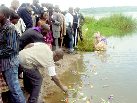 Mourners place flowers on Lake Mugesera where  Rukumberi Genocide victims were dumped (Photo E Musoni).