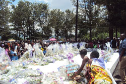 Mourners laying wreaths at mass graves  at Kiziguro genocide memorial site. (Photo.D Ngabonziza).