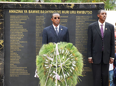 Senate president Dr Vincent Biruta (L) and CNLG Executive Secretary, Jean de Dieu Mucyo, after laying a wreath in memory of slain politicians yesterday. (Photo / T. Kisambira)