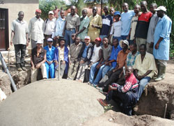 Biogas technicians pose for a group picture with residents of Eastern Province (Photo; S. Rwembeho)