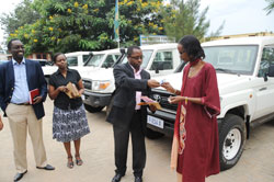 Dr. Fidel Ngabo (2nd right) during the hand over of vehicles to representatives of NGOs. Looking on are Dr. Daniel Ngamije (L) and Dr. Corine Karema (Photo; J. Mbanda)