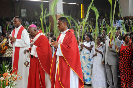 The Archbishop of Kigali Diocese, Thaddu00e9e Ntihinyurwa (C) leads worshippers in the Palm Sunday mass at St Michael's Church in Kigali.  (Photo T.Kisambira)