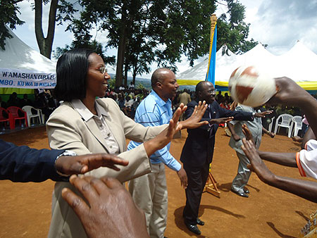 Dignitaries share the joy that came with connecting  Nkombo to the national electricty grid. (Photo L. Nakayima)