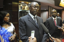 Premier Bernard Makuza speaking to the press on his arrival from the EAC summit  Tuesday.