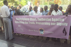 A Guide briefs students from Mt Kenya University during their visit at Kigali Memorial site. (Photo G. Mugoya).