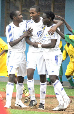 Justin Mico (C) is  mobbed by teammates during the 2011 Africa U-17 Championship. He is expected to lead Rwanda's attack today. (File Photo)