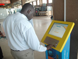 A man surfs the internet from a display Kiosk. Similar facilities will be installed at courthouses.