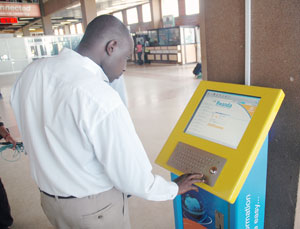 A man surfs the internet from a display Kiosk. Similar facilities will be installed at courthouses. (File photo)