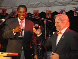 The Dutch Ambassador to Rwanda Frans Makken (R) tosses a glass of wine with Ambassador Ben Rutsinga during the celebrations to mark the Queens Day (Photo T.Kisambira).